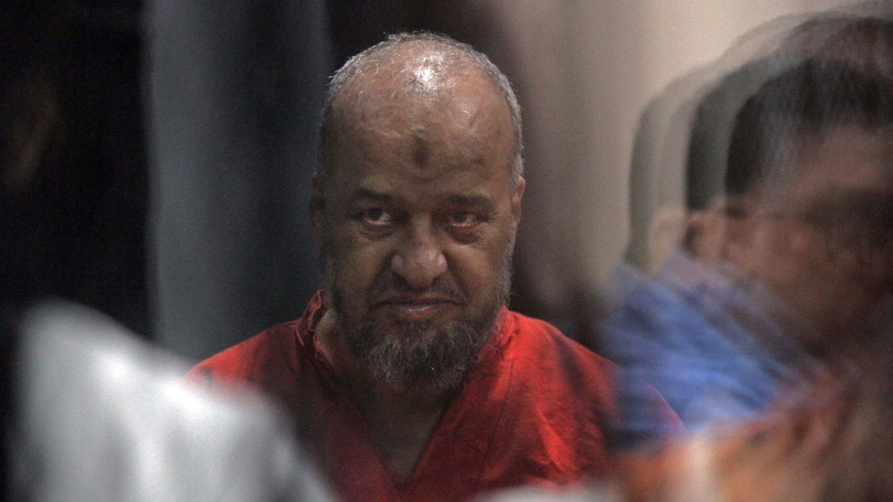 Senior Egyptian Muslim Brotherhood member Mohamed el-Beltagi is seen behind bars during a verdict and sentencing session of a retrial for him and other Brotherhood members.