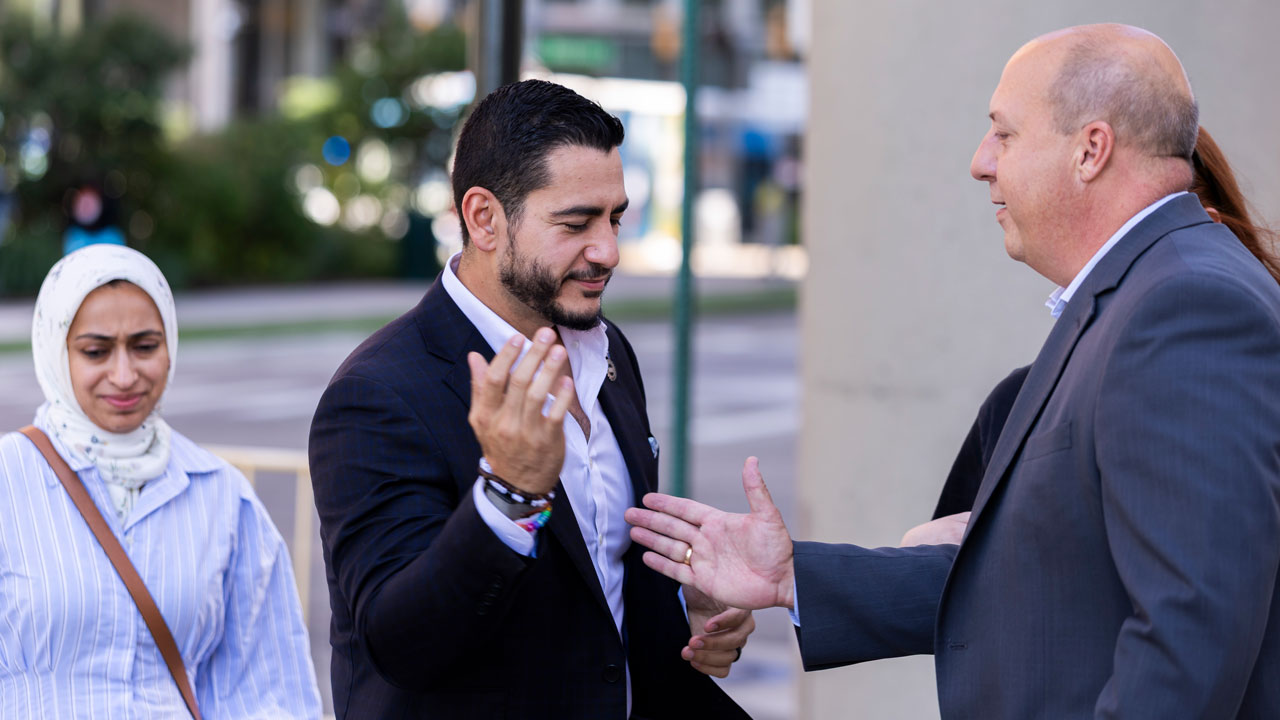 Home 2 Michigan Democratic Senate primary winner Abdul El-Sayed greets Party chair.