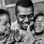 Father with his two daughters.