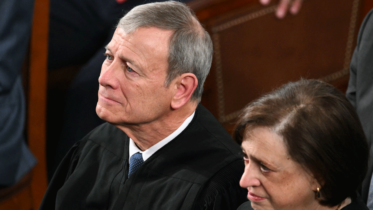 L/R) Supreme Court Chief Justice John Roberts and Supreme Court Justice Elena Kagan listen as US President Donald Trump delivers the State of the Union address in the House Chamber of the US Capitol in Washington, DC, on February 24, 2026. (Photo by Mandel NGAN / AFP via Getty Images)