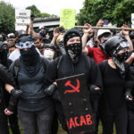 Members of Antifa line up during an alt-right rally on August 17, 2019 in Portland, Oregon.