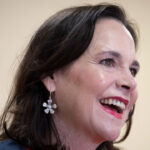 Jane Timken looks to the side and smiles.
