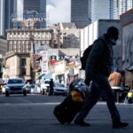 A homeless man walks through Los Angeles skid row.