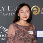 Eileen Wang, former mayor of Arcadia California stands and smiles at the 2023 Asian hall of fame induction ceremony.