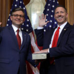 U.S. Speaker of the House Rep. Mike Johnson (R-LA) (L) participates in a ceremonial swearing-in with Rep. Josh Brecheen (R-OK) at the U.S. Capitol on January 3, 2025 in Washington, DC.