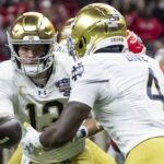 Two football players during a game