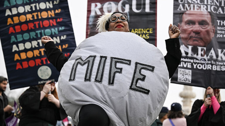 A woman dressed as a mifepristone pill dances with supporters of Planned Parenthood and pro-choice activists during a rally outside the US Supreme Court on April 2, 2025, in Washington, DC. (DREW ANGERER/AFP/Getty Images)
