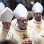 A priest and several Catholic bishops