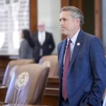 Texas state Rep. Brian Harrison arrives in the House Chamber at the Capitol in Austin.