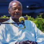 Yoweri Museveni speaking while seated