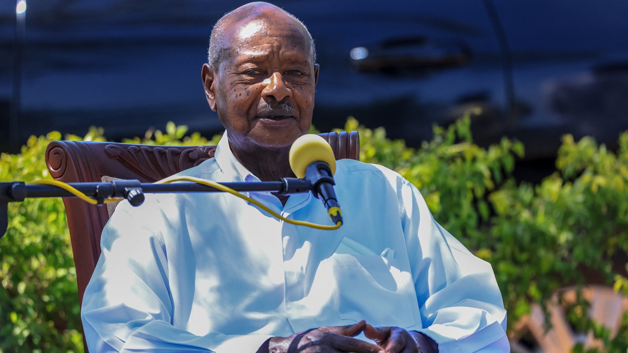 Yoweri Museveni speaking while seated