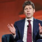 OpenAI CEO Sam Altman speaking while seated