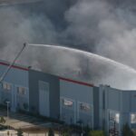 Firefighters attempt to extinguish a fire at the Kimberly-Clark paper products facility.