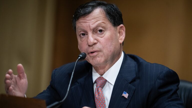 Frank Bisignano speaking into a microphone