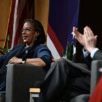 John Bolton and Susan Rice seated
