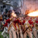 Revolutionary War reenactors firing guns