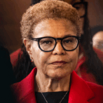 Karen Bass stands with a straight face.