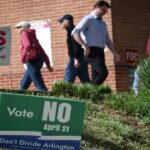 Virginia voters leave a polling location after voting on a statewide ballot question.