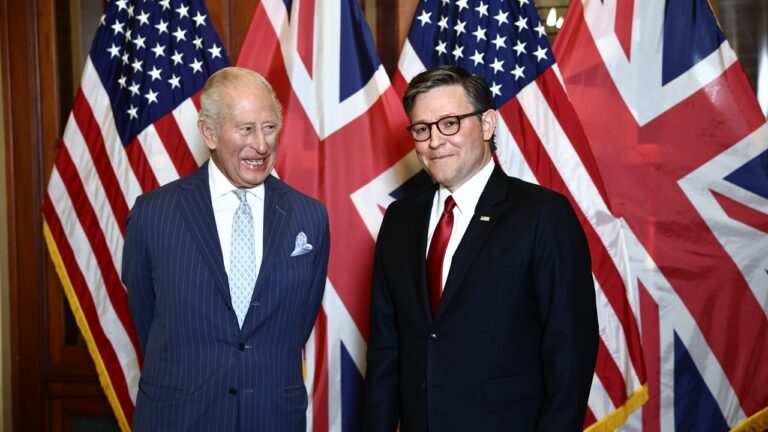 King Charles and Mike Johnson standing
