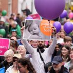 Pro-life campaigners take part in a march.