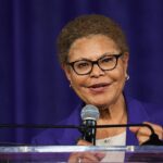 Los Angeles Mayor Karen Bass speaks into a microphone.