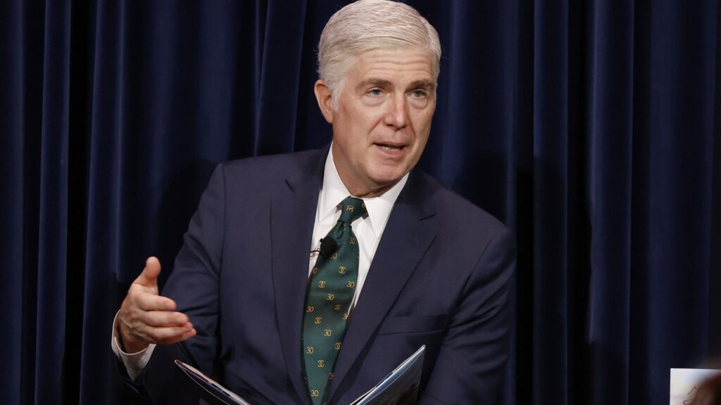 Supreme Court Justice Neil Gorsuch speaking while seated