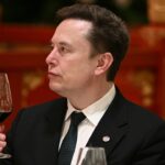Elon Musk holding a wine glass