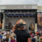 Attendees celebrate during "Rededicate 250: A National Jubilee of Prayer, Praise and Thanksgiving" on the National Mall in Washington, DC, on May 17, 2026.