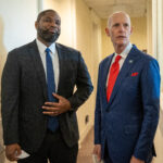 Rick Scott (R) talks with Congressman Byron Donalds (L) ahead of a press conference to discuss the Department of Justiceâs indictment of Raul Castro, at the U.S. Capitol.