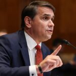 Acting U.S. Attorney General Todd Blanche holding up a finger while speaking