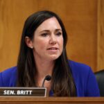 Sen. Katie Britt, seated