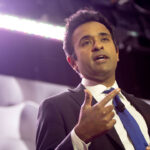 Republican nominee for Ohio governor Vivek Ramaswamy gestures from the stage for an event.