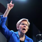 Sen. Elizabeth Warren speaking with her finger pointing in the air