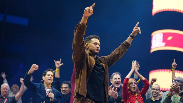 Patrick Mahomes with his hands raised