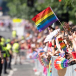 An attendee waves a pride flag at the Capitol Pride Parade on June 20, 2026 in Washington, DC.