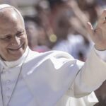 Pope Leo XIV waving and smiling