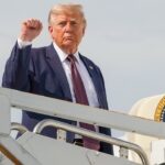 President Donald Trump holding up a fist