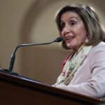 Nancy Pelosi at a podium