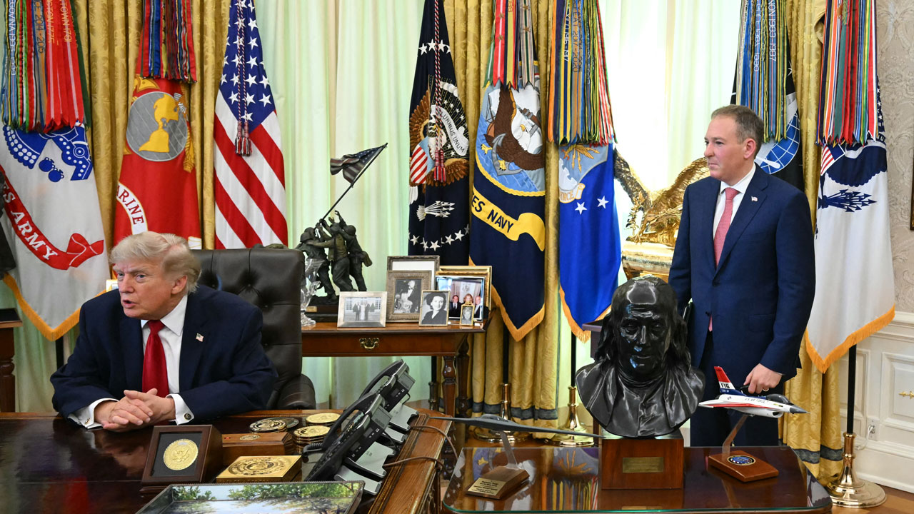 The Administrator of the US Environmental Protection Agency Lee Zeldin (R) looks on as US President Donald Trump speaks after signing a presidential memo on pollution control in vehicles at the Oval Office of the White House in Washington, DC, on June 29, 2026.