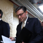Speaker of the House Mike Johnson (R-LA) walks to a news conference.