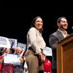 Michigan Democratic candidate for Senate Abdul El-Sayed and U.S. Rep. Alexandria Ocasio-Cortez stand together at a podium.