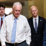 U.S. Sen. Ron Johnson (R-WI), Sen. Rick Scott (R-FL), and Sen. Mike Lee (R-UT) walk towards Senate Chambers in the U.S. Capitol.