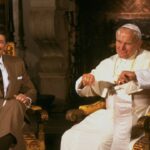 President Ronald Reagan sitting with Pope John Paul II