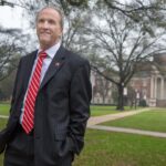 Stuart R. Bell, former president of the University of Alabama, walks on the quad in Tuscaloosa.
