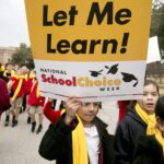 Child protester holding a sign that says "Let me learn! National School Choice Week"