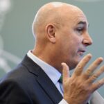 Hugh Grant, CEO of Monsanto, looking away from the camera