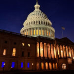 Blue lights honoring law enforcement officers can be seen shining out of Majority Whip Tom Emmers office in the U.S. Capitol in 2025.