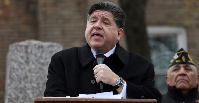 Illinois Gov. JB Pritzker delivers a short speech during a Veterans Day ceremony at Little Village's Manuel Perez Jr. Memorial Plaza on November 11, 2025 in Chicago, Illinois. After being criticized for a photo-op with other federal immigration agents in downtown Chicago on November 10th, Gregory Bonino, the top Border Patrol official leading the charge on the Trump administration's immigration crackdown in Chicago, invited the governor to Little Village. (Photo by Abel Uribe/Getty Images)