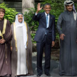 Barack Obama waves alongside delegation leaders following the Gulf Cooperation Council-U.S. summit.