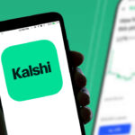 The Kalshi online betting app logo is seen displayed on a smartphone screen.